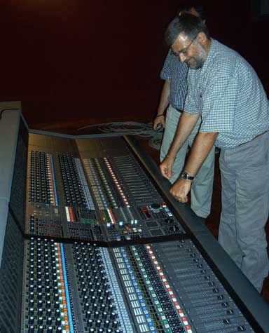 Ricard Casals standing over his new digital console, the AMS Neve DFC (Digital Film Console) in his film mixing room in Barcelona.